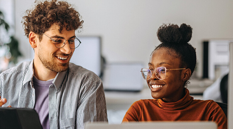 coworkers at an office collaborate