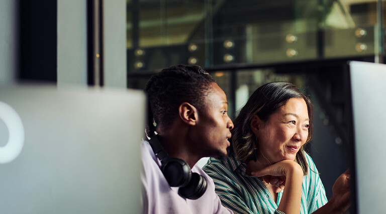 2 people at computer screens