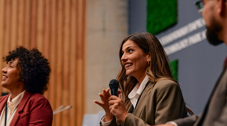 People speaking at conference
