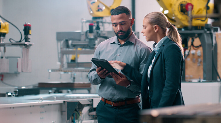 People talking in manufacturing plant