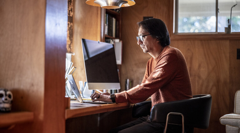 Man looking serious at a computer