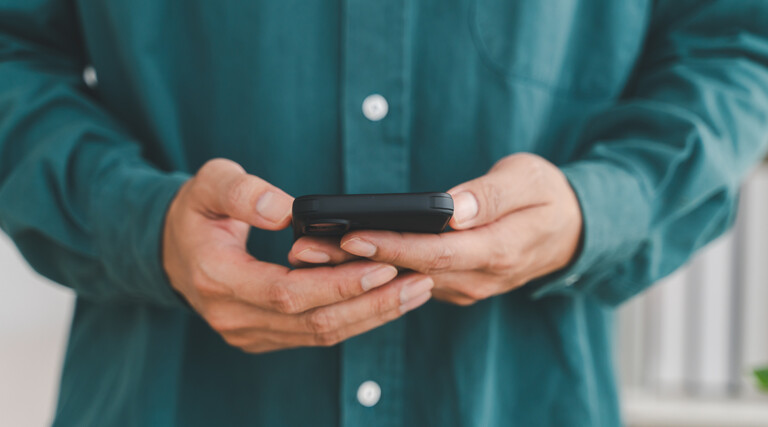 Businessman holding smartphone