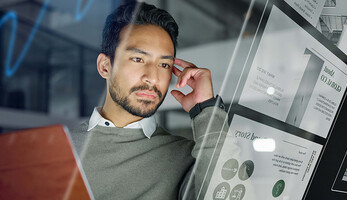 Man with computer monitors