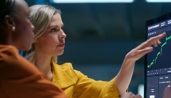 Two women discuss financial topics
