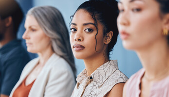 Person looking into camera during meeting