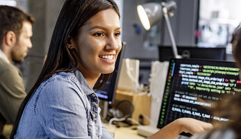 Programmer talking with coworker