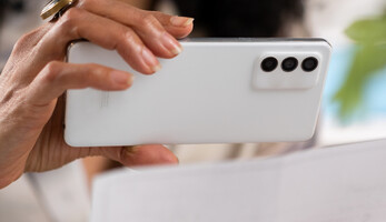 Person depositing check with cell phone