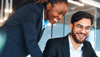 IT leaders working together in office space