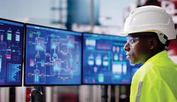 E&U worker looks at data
