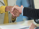 Banker shakes customer's hand