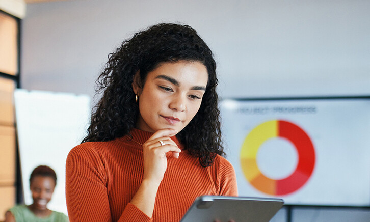 Person reviewing data via tablet