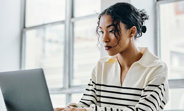 Person using laptop in the office