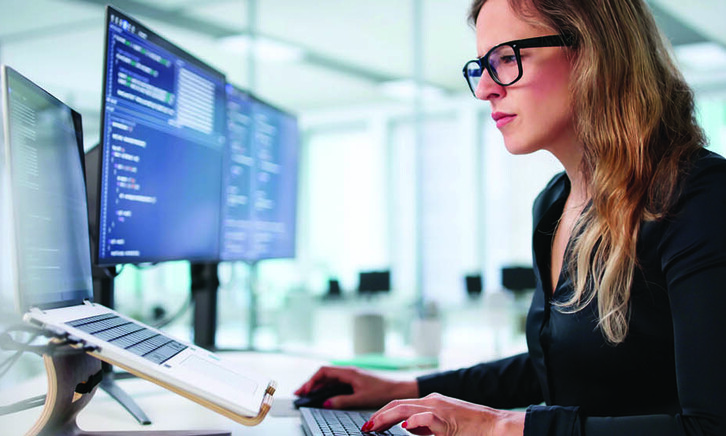 Employee reading computer screen