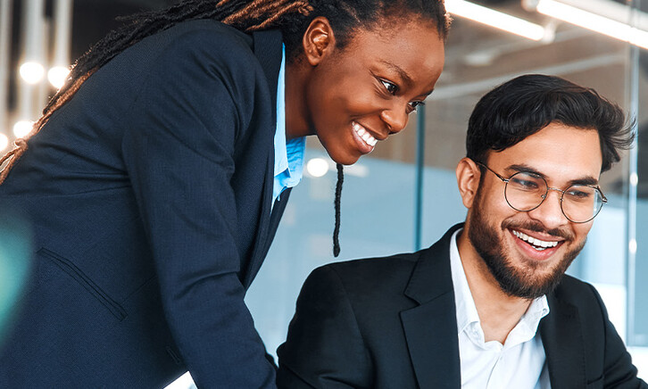 IT leaders working together in office space