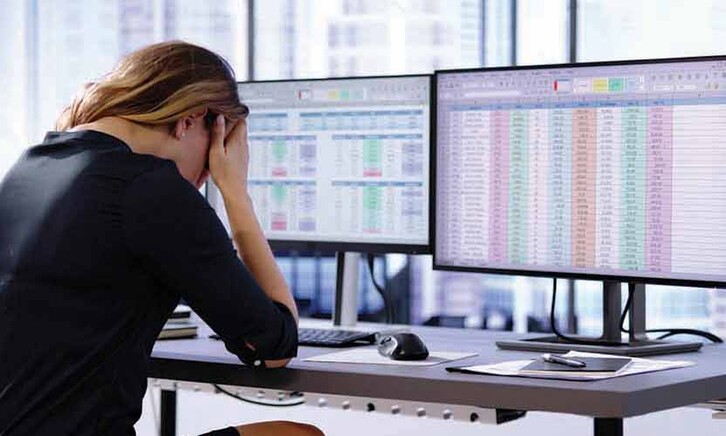 Person working on spreadsheet