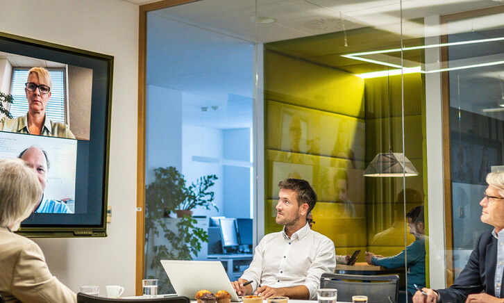 People in a hybrid workspace