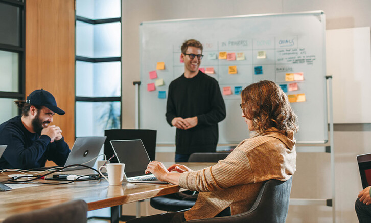 Person leading a meeting in the office