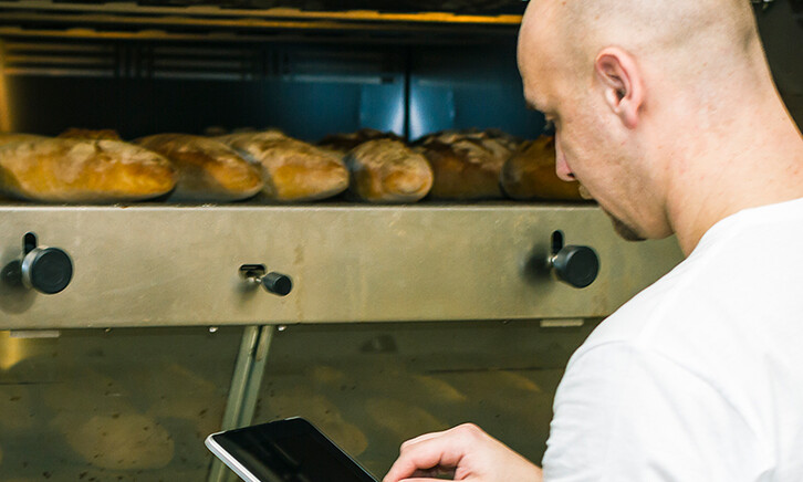Baker using digital tablet