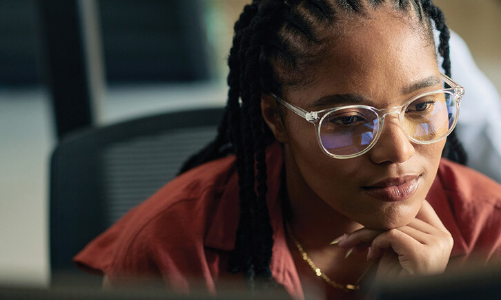 A business leader is coding