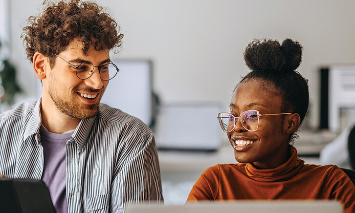 coworkers at an office collaborate
