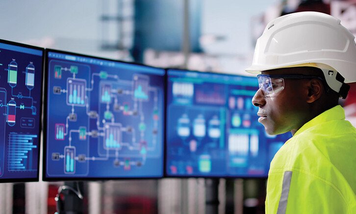 E&U worker looks at data