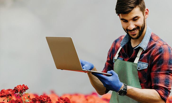 botanist uses laptop in the field
