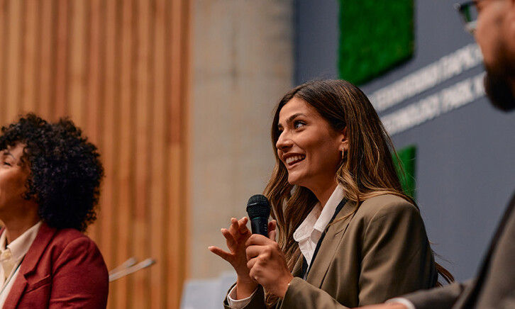 People speaking at conference
