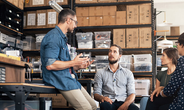 A group of colleagues having a discussion in a workshop