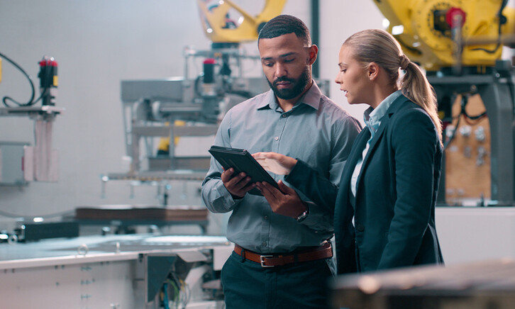 People talking in manufacturing plant