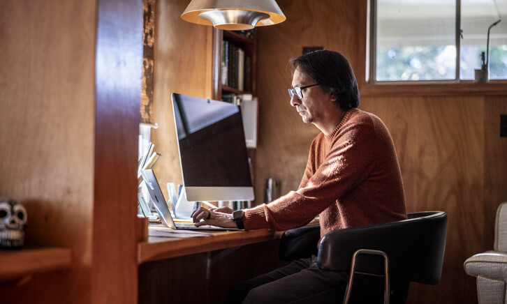 Man looking serious at a computer