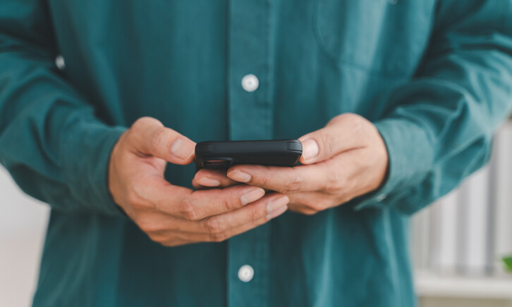 Businessman holding smartphone