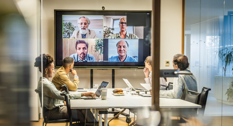 Coworkers in a conference room space