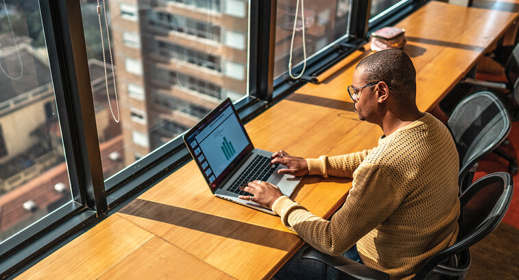 Person working in the office on a laptop