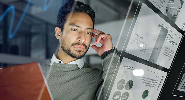 Man with computer monitors