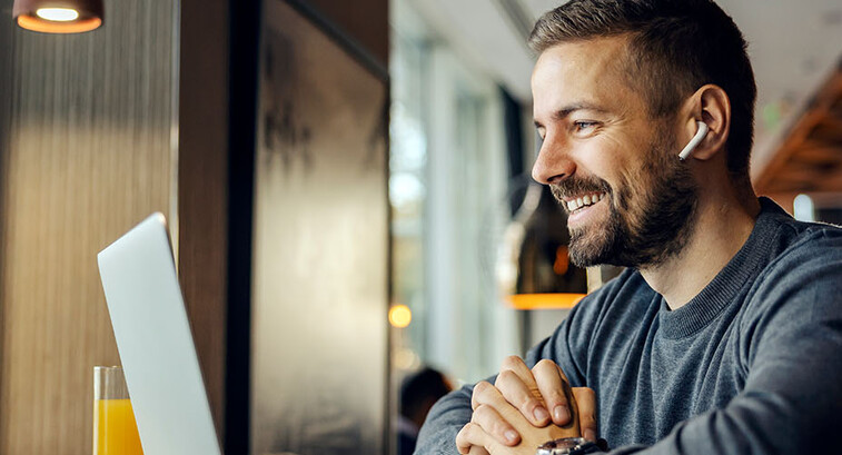 Freelancer sitting having conference call with client