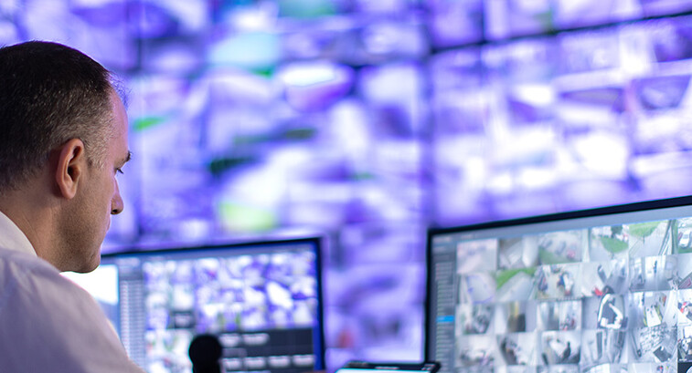 Man working in a security surveillance station