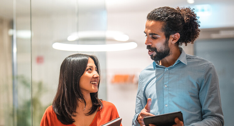 Colleagues talking at work 