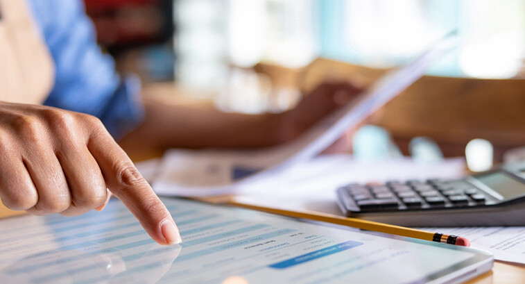 Person calculating business expenses