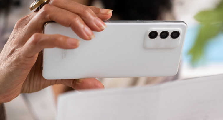 Person depositing check with cell phone