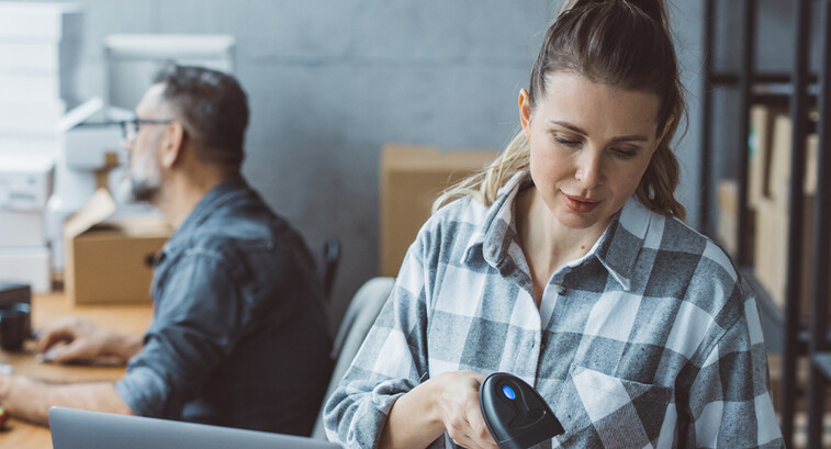 Small business owners processing orders