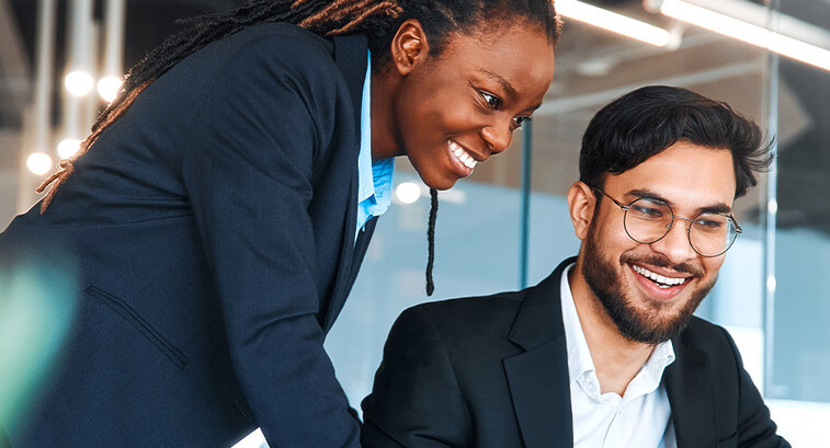 IT leaders working together in office space