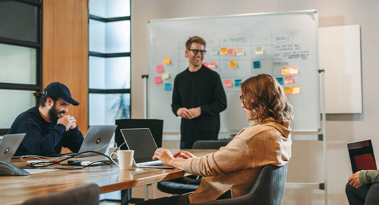 Person leading a meeting in the office