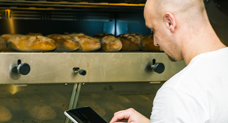 Baker using digital tablet