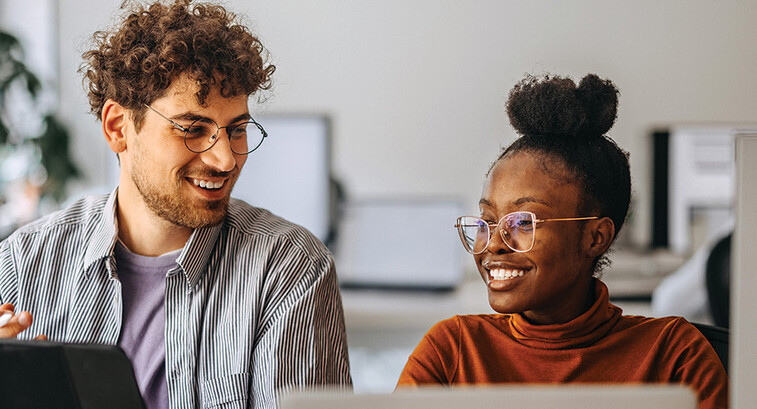 coworkers at an office collaborate