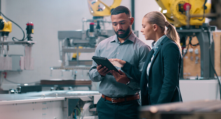 People talking in manufacturing plant