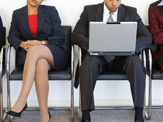 Business man and woman with computer