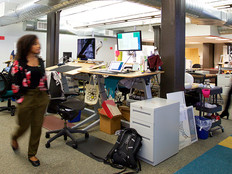 A  wide angle photo people in of the office of the nonprofit Wikimedia Foundation in San Francisco.