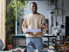 Man talking to 2 people from notes