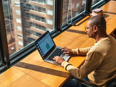 Person working in the office on a laptop