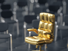 Person walking toward a gold chair